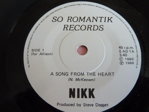 Nikk - A Song From The Heart b/w Sandie's Smile - 7 Inch